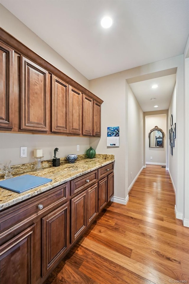 12121 Bryant St, Westminster, CO 80234 - kitchen with light wood finished floors, light stone counters, and recessed lighting