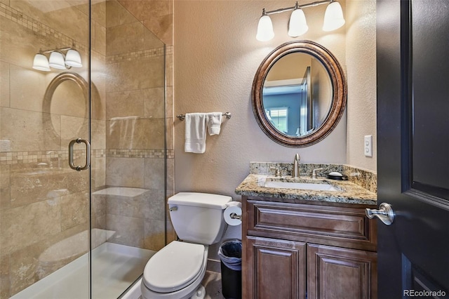 12121 Bryant St, Westminster, CO 80234 - full bath featuring a shower stall, a textured wall, and vanity