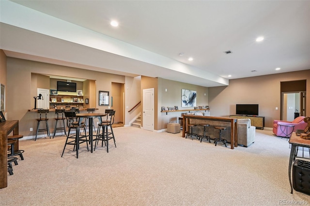 12121 Bryant St, Westminster, CO 80234 - dining area featuring wet bar, light carpet, recessed lighting, and stairs