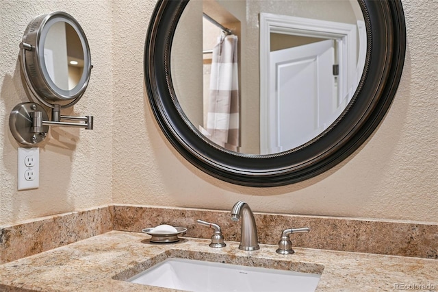 12121 Bryant St, Westminster, CO 80234 - bathroom with a textured wall and vanity