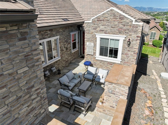 12121 Bryant St, Westminster, CO 80234 - view of patio featuring outdoor lounge area and a mountain view