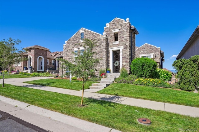 12121 Bryant St, Westminster, CO 80234 - view of front of house featuring stone siding and a front lawn