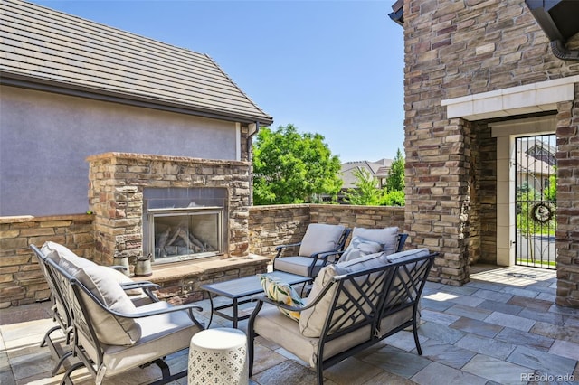 12121 Bryant St, Westminster, CO 80234 - view of patio featuring an outdoor living space with a fireplace