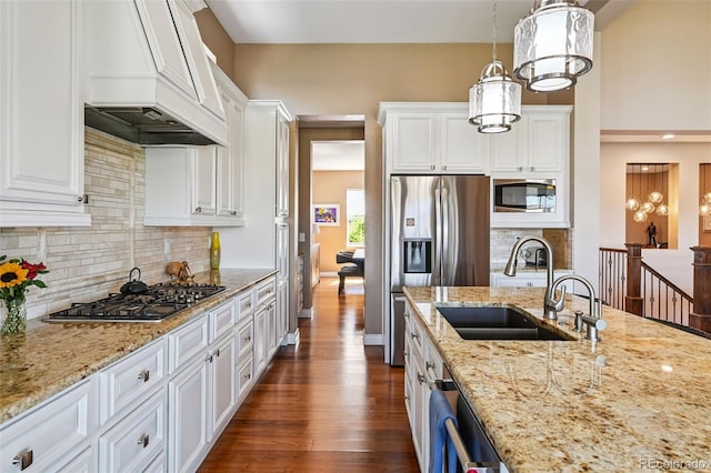 12121 Bryant St, Westminster, CO 80234 - kitchen featuring appliances with stainless steel finishes, custom range hood, dark wood-style flooring, and white cabinets