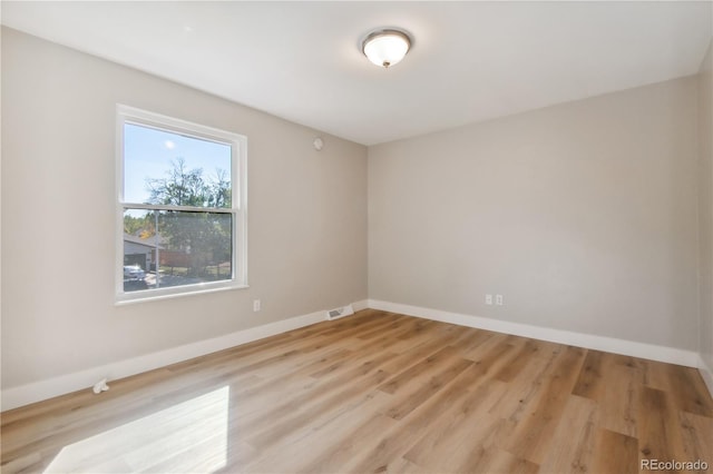 unfurnished room featuring light hardwood / wood-style floors