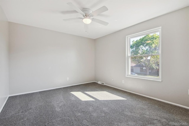 carpeted empty room with ceiling fan