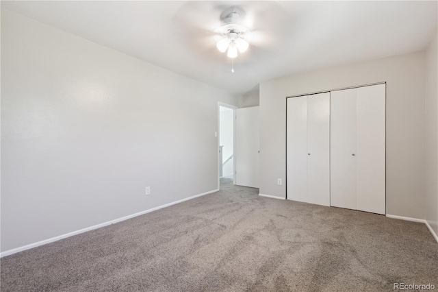 unfurnished bedroom with a closet, ceiling fan, and light colored carpet