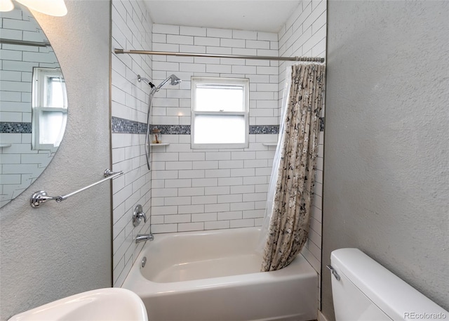 1726 E Evans Ave, Pueblo, CO 81004 - full bathroom with toilet, shower / bathtub combination with curtain, and a textured wall
