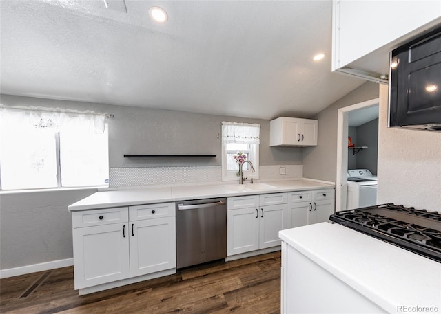 1726 E Evans Ave, Pueblo, CO 81004 - kitchen with stainless steel dishwasher, a sink, white cabinets, dark wood-type flooring, and vaulted ceiling