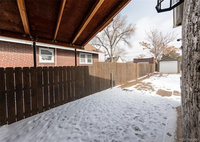 1726 E Evans Ave, Pueblo, CO 81004 - snowy yard with a detached garage