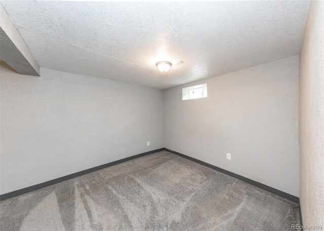 1726 E Evans Ave, Pueblo, CO 81004 - empty room with a textured ceiling, carpet floors, and baseboards