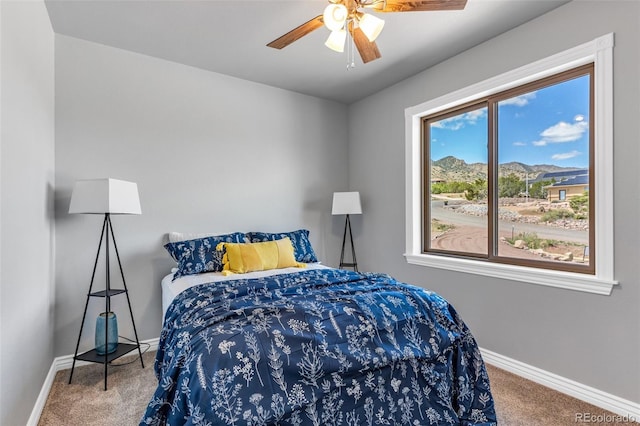 bedroom featuring ceiling fan and carpet floors