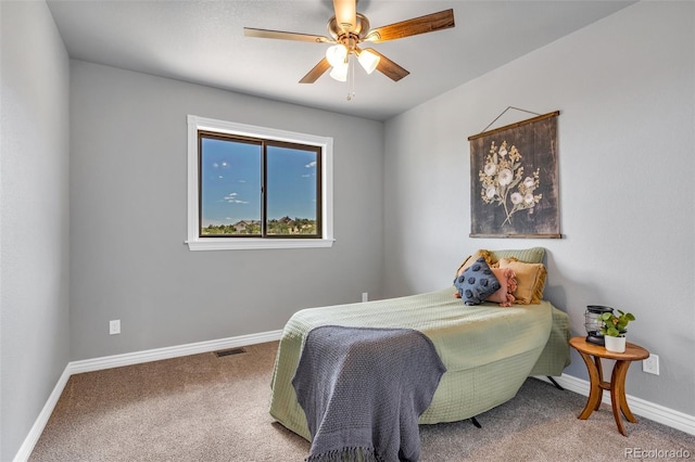 carpeted bedroom with ceiling fan