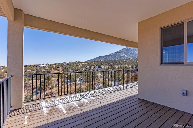 wooden terrace with a mountain view