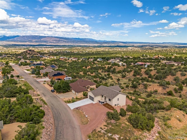 drone / aerial view featuring a mountain view