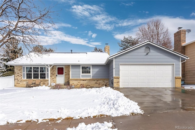 ranch-style home featuring a garage, concrete driveway, brick siding, and a chimney