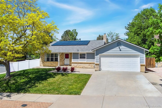 1606 S Flanders Way, Aurora, CO 80017 - ranch-style house with brick siding, roof mounted solar panels, concrete driveway, a garage, and a chimney