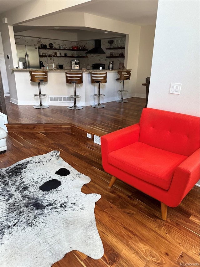 8747 Mesquite Row, Lone Tree, CO 80124 - living room featuring wet bar and wood finished floors