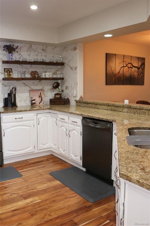 8747 Mesquite Row, Lone Tree, CO 80124 - kitchen featuring black dishwasher, open shelves, white cabinets, light wood finished floors, and decorative backsplash