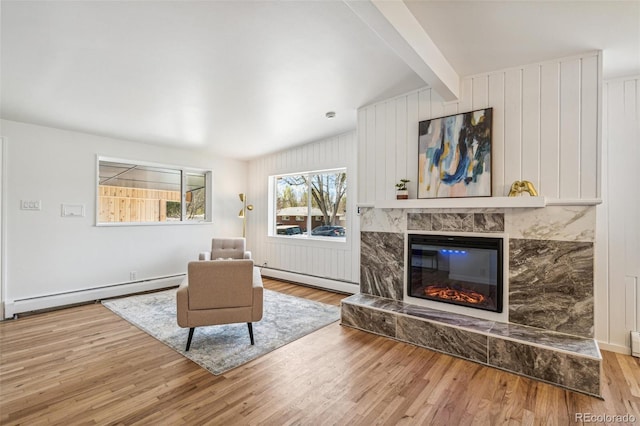 6170 Estes Ct, Arvada, CO 80004 - living room featuring a baseboard radiator, beam ceiling, a baseboard heating unit, and wood finished floors