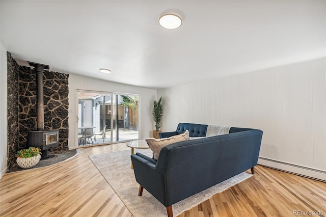 6170 Estes Ct, Arvada, CO 80004 - living room featuring a wood stove and wood finished floors