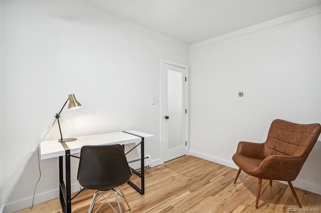 6170 Estes Ct, Arvada, CO 80004 - home office featuring baseboards, a baseboard heating unit, and light wood finished floors