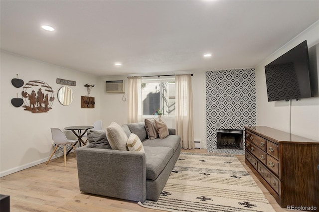 336 N Grant St Unit 206, Denver, CO 80203 - living room featuring baseboards, light wood-type flooring, an AC wall unit, and recessed lighting