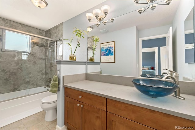 bathroom featuring tile patterned floors, toilet, vanity, and bathtub / shower combination