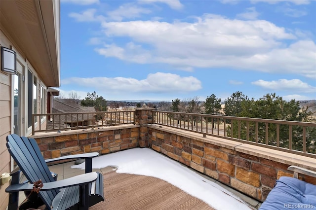 view of patio featuring a balcony