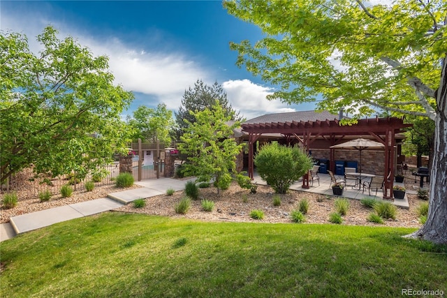 view of yard with fence, a gate, a patio area, and a pergola