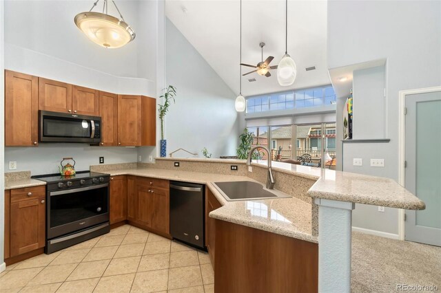 8627 Gold Peak Pl Unit C, Highlands Ranch, CO 80130 - kitchen with dishwasher, stainless steel range oven, high vaulted ceiling, black microwave, and brown cabinets