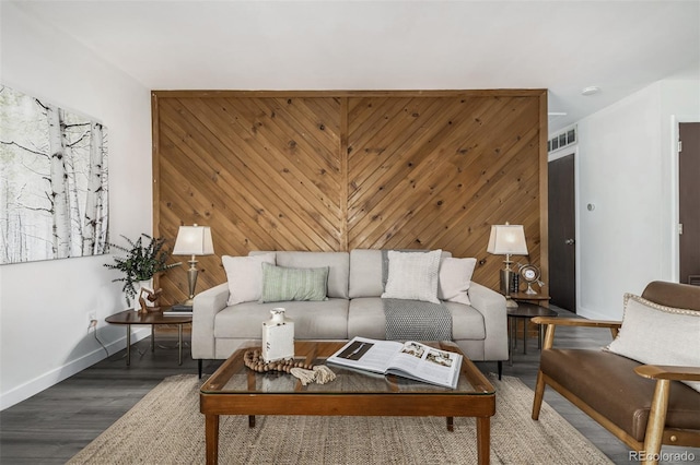 living room featuring wood walls and hardwood / wood-style floors