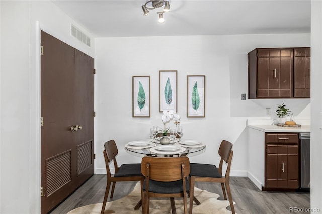 dining area with wood-type flooring