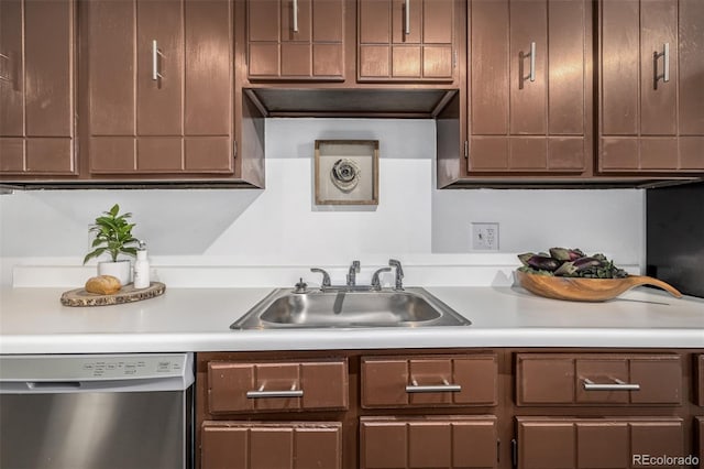 kitchen featuring sink, dark brown cabinetry, and stainless steel dishwasher