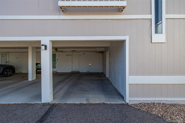 garage featuring wooden walls