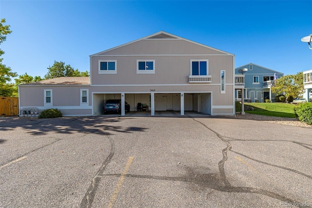 view of front of home with a carport