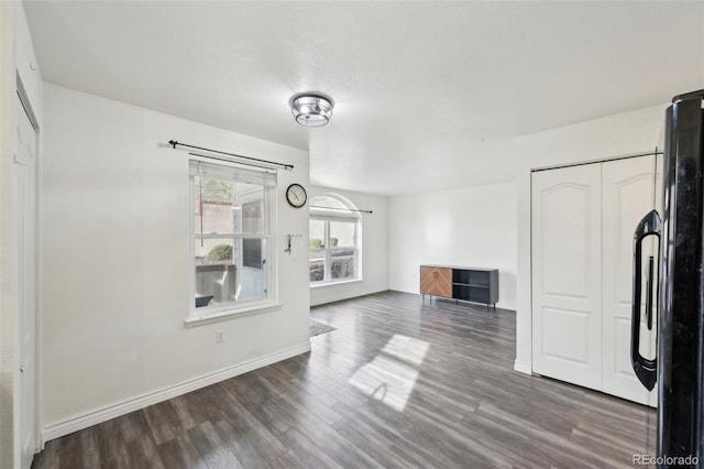 living room featuring wood finished floors and baseboards