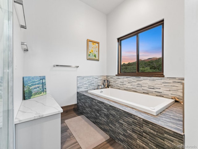 12947 Lazy Dog Ln, Littleton, CO 80127 - full bath with a bath and wood finished floors