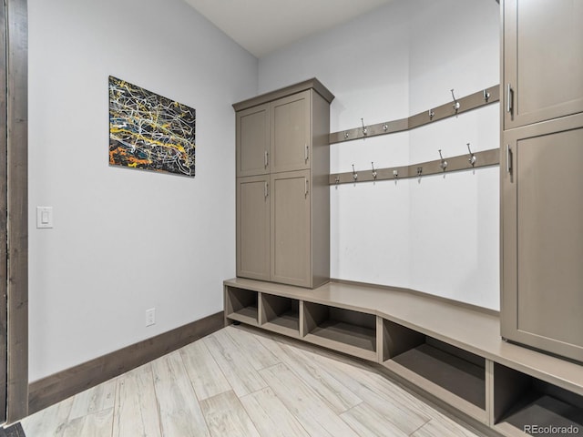 12947 Lazy Dog Ln, Littleton, CO 80127 - mudroom featuring baseboards and wood finished floors