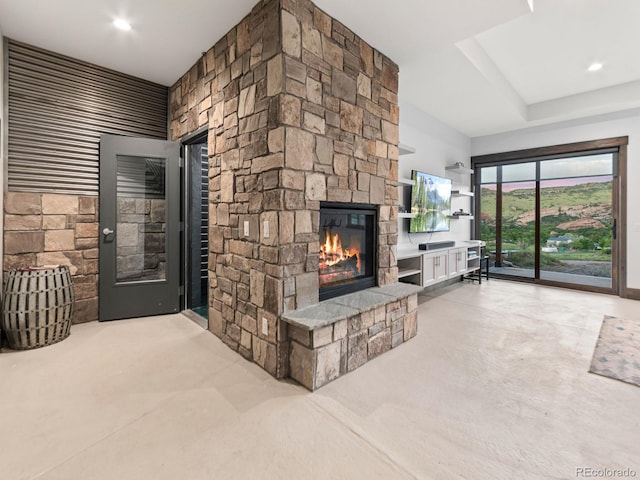 12947 Lazy Dog Ln, Littleton, CO 80127 - carpeted living area featuring a stone fireplace