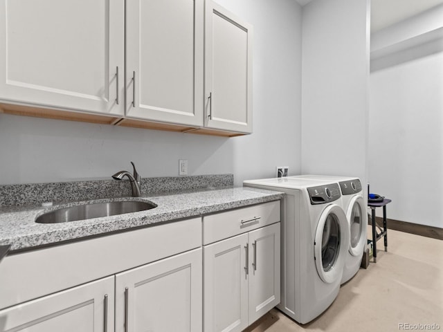 12947 Lazy Dog Ln, Littleton, CO 80127 - washroom featuring cabinet space and washing machine and clothes dryer
