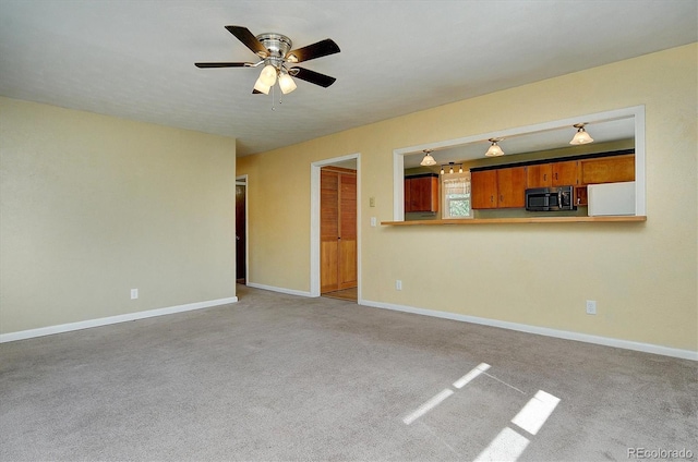 620 James Pl, Buena Vista, CO 81211 - unfurnished living room with ceiling fan and carpet floors