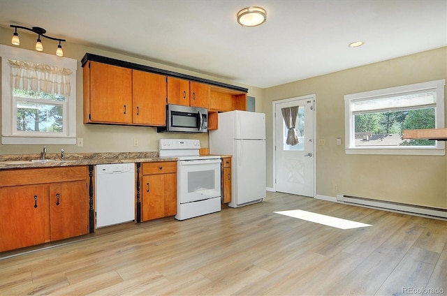 620 James Pl, Buena Vista, CO 81211 - kitchen with white appliances, a baseboard radiator, healthy amount of natural light, and light wood finished floors