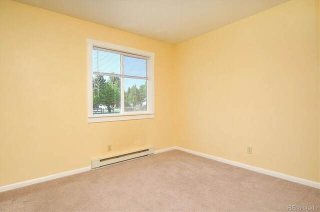 620 James Pl, Buena Vista, CO 81211 - unfurnished room with a baseboard radiator and light colored carpet