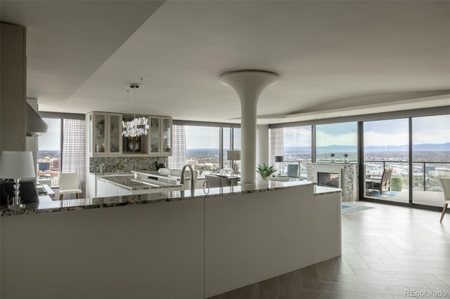 1133 14th St Unit 3430, Denver, CO 80202 - living area featuring a healthy amount of sunlight, expansive windows, and a mountain view