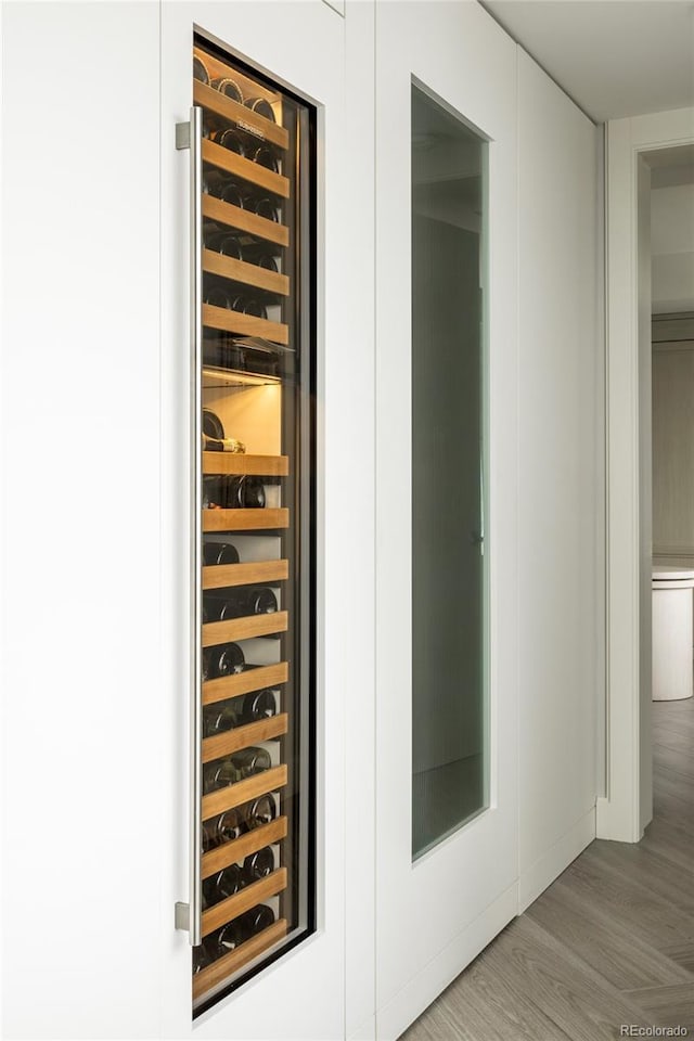 1133 14th St Unit 3430, Denver, CO 80202 - wine cellar featuring wood finished floors and wine cooler