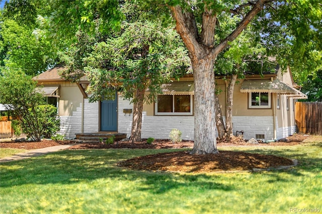 2680 S Garfield Cir, Denver, CO 80210 - view of property hidden behind natural elements featuring stone siding and brick siding