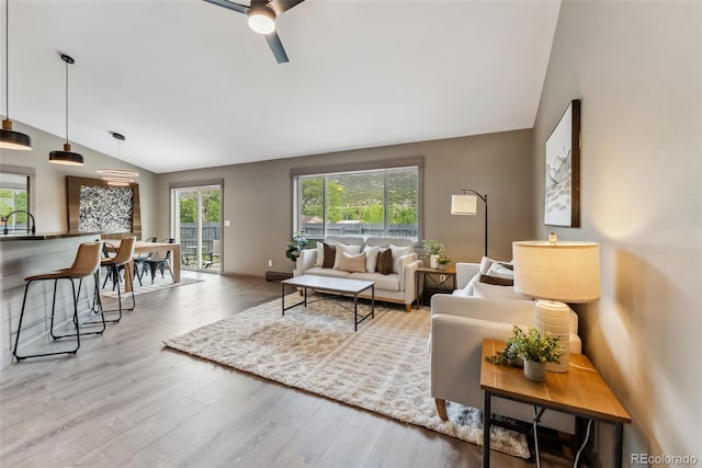 143 Brady Rd, Buena Vista, CO 81211 - living area with vaulted ceiling, ceiling fan, wood finished floors, and baseboards