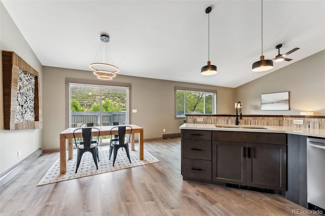 143 Brady Rd, Buena Vista, CO 81211 - kitchen with a sink, dishwasher, lofted ceiling, light wood finished floors, and light countertops