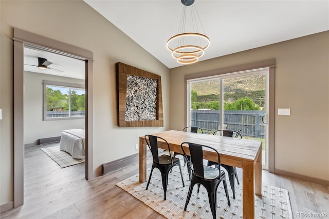 143 Brady Rd, Buena Vista, CO 81211 - dining area featuring light wood-style floors, healthy amount of natural light, a chandelier, and vaulted ceiling